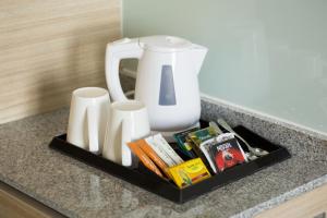 a tray on a counter with a blender and cups at Holiday Inn Express Semarang Simpang Lima, an IHG Hotel in Semarang