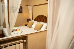 a view of a bedroom with a bed and a mirror at Navona Apartment in Rome +39 photos