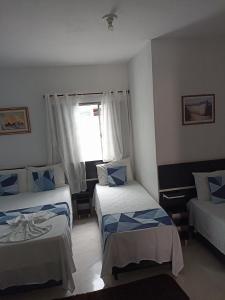 Cama ou camas em um quarto em Pousada Antares
