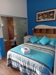Cama ou camas em um quarto em Pousada Antares