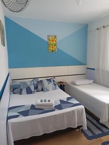 Cama ou camas em um quarto em Pousada Antares