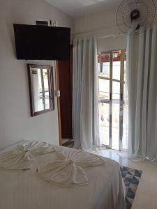 Cama ou camas em um quarto em Pousada Antares