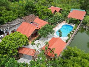 an aerial view of a house with a swimming pool at Phạm Gia Homestay Ecogarden in Ninh Binh