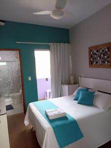 Cama ou camas em um quarto em Pousada Antares