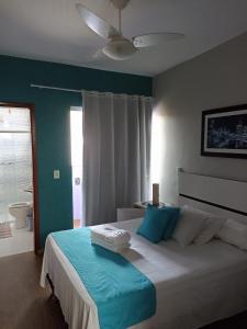 Cama ou camas em um quarto em Pousada Antares