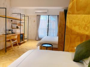 Postel nebo postele na pokoji v ubytování 法格洛絲文旅