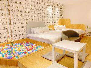 Postel nebo postele na pokoji v ubytování 法格洛絲文旅
