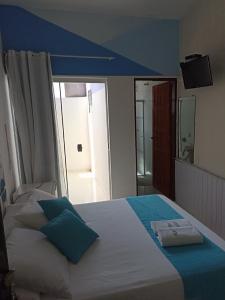 Cama ou camas em um quarto em Pousada Antares