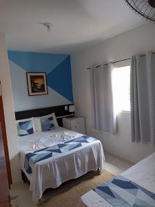 Cama ou camas em um quarto em Pousada Antares