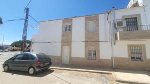 a car parked in front of a building at Casa Nina in Linares