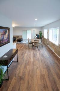 a large living room with a table and chairs at Private Mountainside Home in Chilliwack
