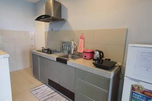 a kitchen with a sink and a counter top at NC Cottage @ The Loft Imago in Kota Kinabalu
