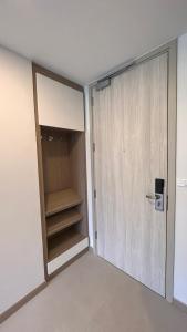 an empty room with a closet and a door at Sky Park Laguna 1bdr Lake View in Thalang