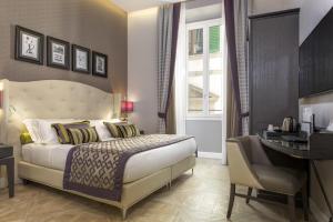 Postel nebo postele na pokoji v ubytování Hotel Spadai