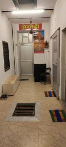 a room with a door and a table and a chair at Raghuvanshi Paying Guest House in Varanasi
