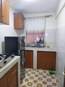 a kitchen with a sink and a counter top at Ole kerai #101 in Nairobi