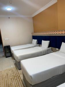 Giường trong phòng chung tại فندق درة بيسان