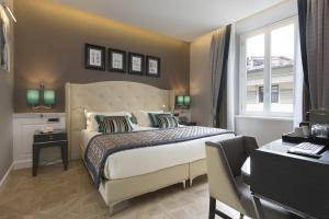 Postel nebo postele na pokoji v ubytování Hotel Spadai