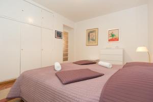 Кровать или кровати в номере Apartment Gloria