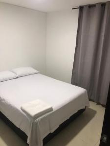 Postel nebo postele na pokoji v ubytování Apartamento cerca estacion de lagos + 10 fotografií