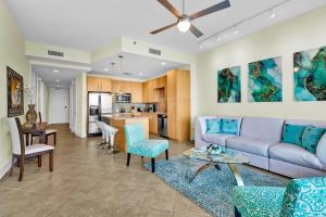 a living room with a couch and a table at Sapphire Condominiums #806 in South Padre Island