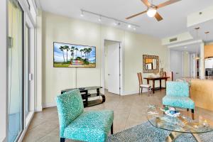 a living room with a table and chairs at Sapphire Condominiums #806 in South Padre Island