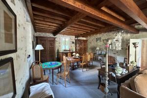 a kitchen and dining room with a table and chairs at Rare pearl with garden near the sea in La Baule