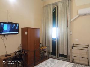 A bed or beds in a room at Al Duomo