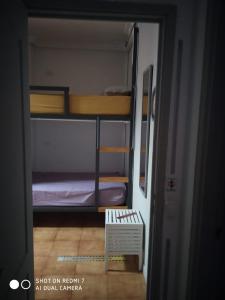 a view of a room with bunk beds in it at Campobase.box in El Médano