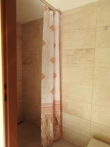 a shower with a shower curtain in a bathroom at Ubytovanie u Krokodíla in Banská Belá +34 photos
