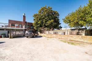 a truck parked in a parking lot next to a building at Why Knot Getaway…Rooftop with WaterView! Unit F in Beaufort