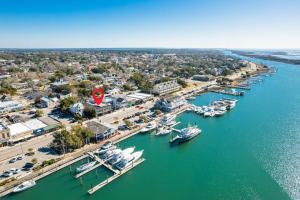 an aerial view of a marina with boats in the water at Why Knot Getaway…Rooftop with WaterView! Unit F in Beaufort