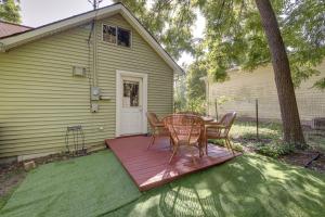 a patio with a table and chairs on a deck at Bloomington Home Rental Near Attractions and IU! in Bloomington