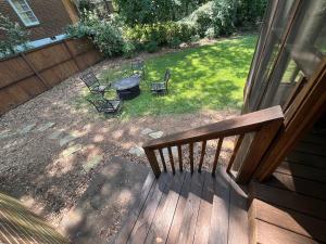 an aerial view of a backyard with a grill and chairs at Modern Athens Home 4bd, 3bth in Athens