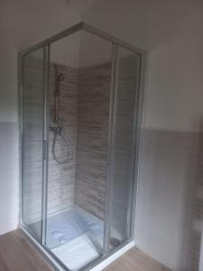 a shower with a glass enclosure in a bathroom at IL VECCHIO CAMINO in Baraggia di Boca