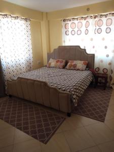 Katil atau katil-katil dalam bilik di Malaika Comfort Homes