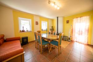 a dining room with a table and chairs at Nebesa so tudi na zemlji in Tomaž pri Ormožu