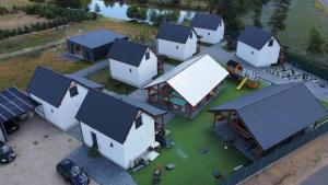 an aerial view of a group of houses with roofs at Łap chwilę Ostrowo in Ostrowo