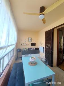 a living room with a blue table and a couch at Tuscan Gallery House in Grosseto