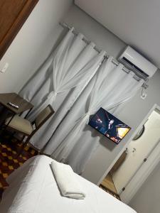 Postel nebo postele na pokoji v ubytování Hotel Dom Marechal neoclássico