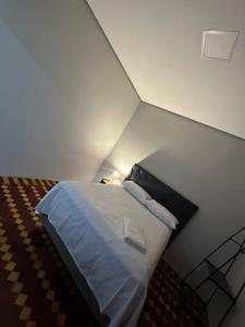 Postel nebo postele na pokoji v ubytování Hotel Dom Marechal neoclássico