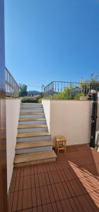 a stairway with a bench and a table on a building at La casa al mare, Pittulongu in Olbia +28 photos