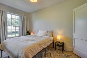 a bedroom with a bed and a window at Pet-Friendly Pueblo Vacation Rental with Patio! in Pueblo