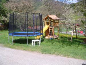 a playground with a slide and a play structure at Ferienwohnung Boahof in Lessach