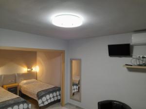 Postel nebo postele na pokoji v ubytování apartament bermudas