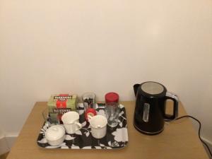 a tray with cups and other items on a table at Ocean Waves in Gorleston-on-Sea