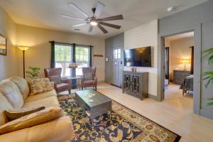 a living room with a couch and a tv at Charming Clarkdale Home - Half Mi to Downtown! in Clarkdale