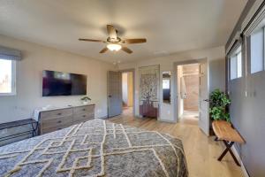 a bedroom with a bed and a ceiling fan at Charming Clarkdale Home - Half Mi to Downtown! in Clarkdale