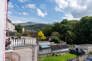 a view from the balcony of a house with mountains in the background at Tryfan - Snowdonia, North Wales in Bethesda