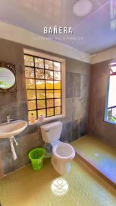 a bathroom with a toilet and a sink and a tub at Tana - Casa & Cabaña de Montaña y Lago in Prado